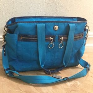 Bright blue Coach Diaper bag. Hot pink inside!
